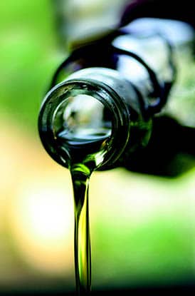 olive oil pouring from bottle